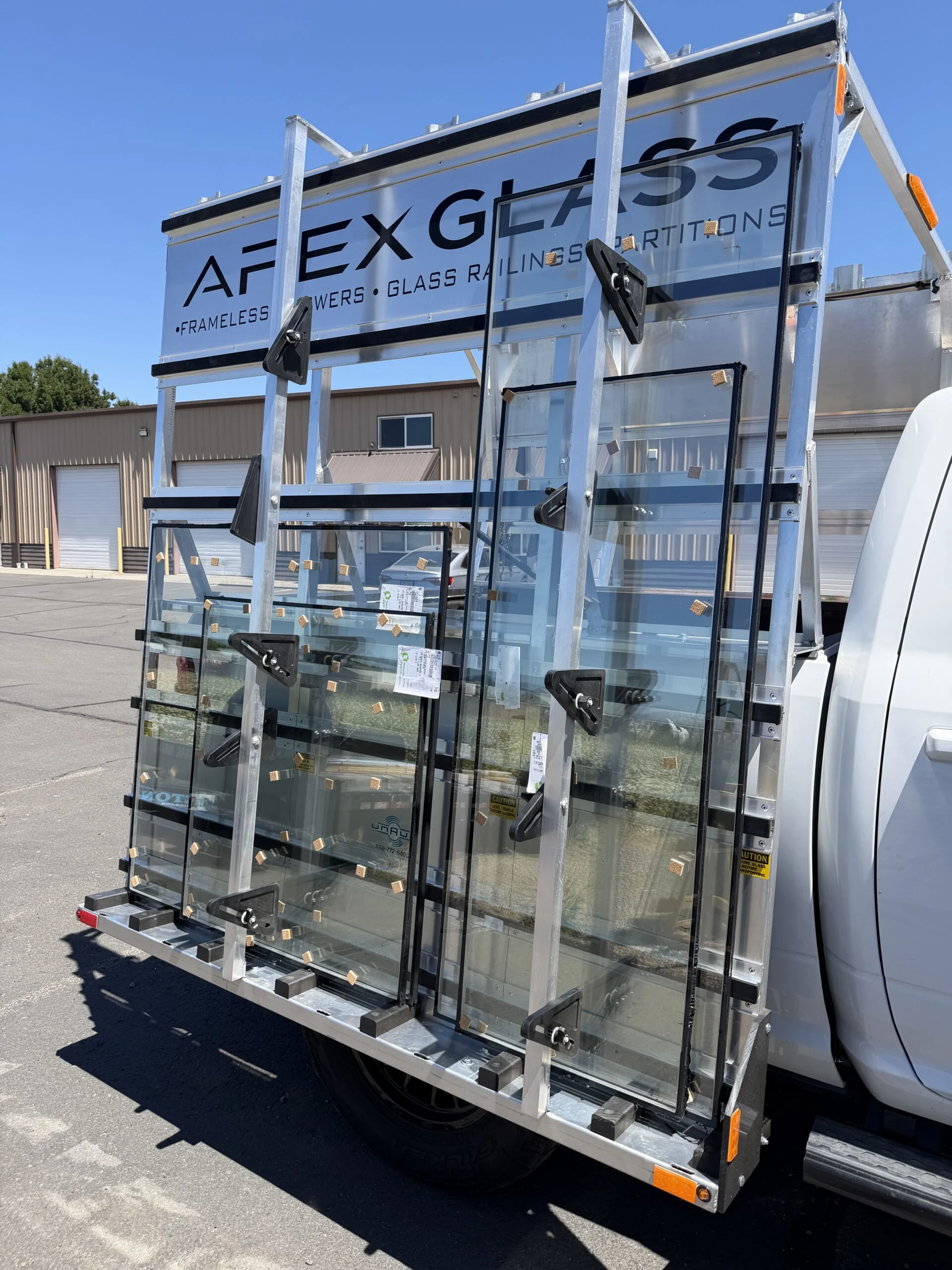 Glass panels strapped to an Apex Glass truck rack