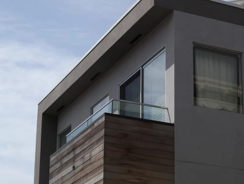 Modern Dark House Exterior Wood Clad Balcony Modern dark house exterior with wood-clad balcony