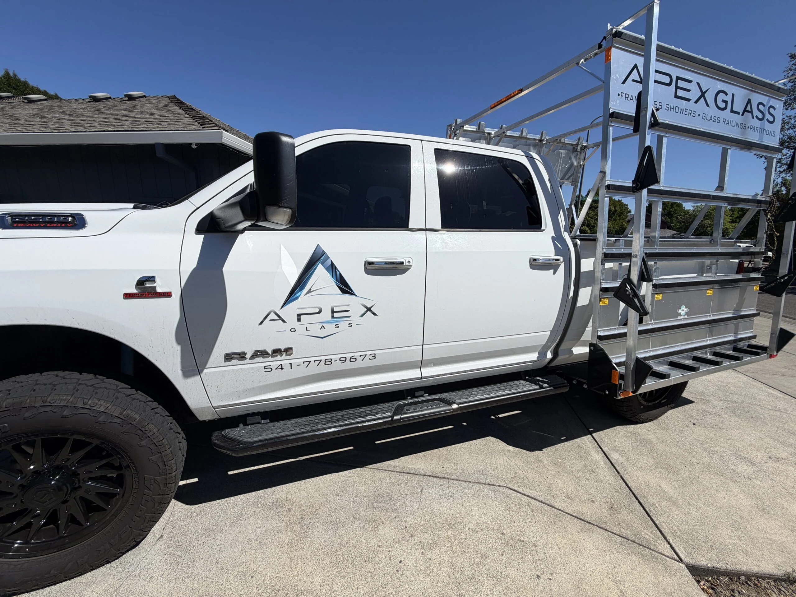 White Apex Glass pickup truck with aluminum glass rack